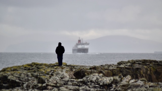 Enthusiast watches the approach of the ferry